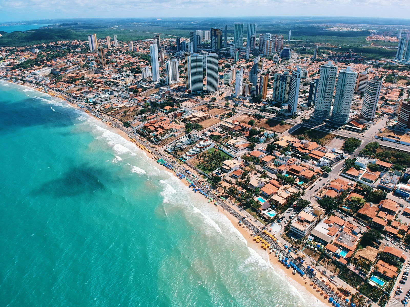 aerial photography of city building near the seashore during daytime